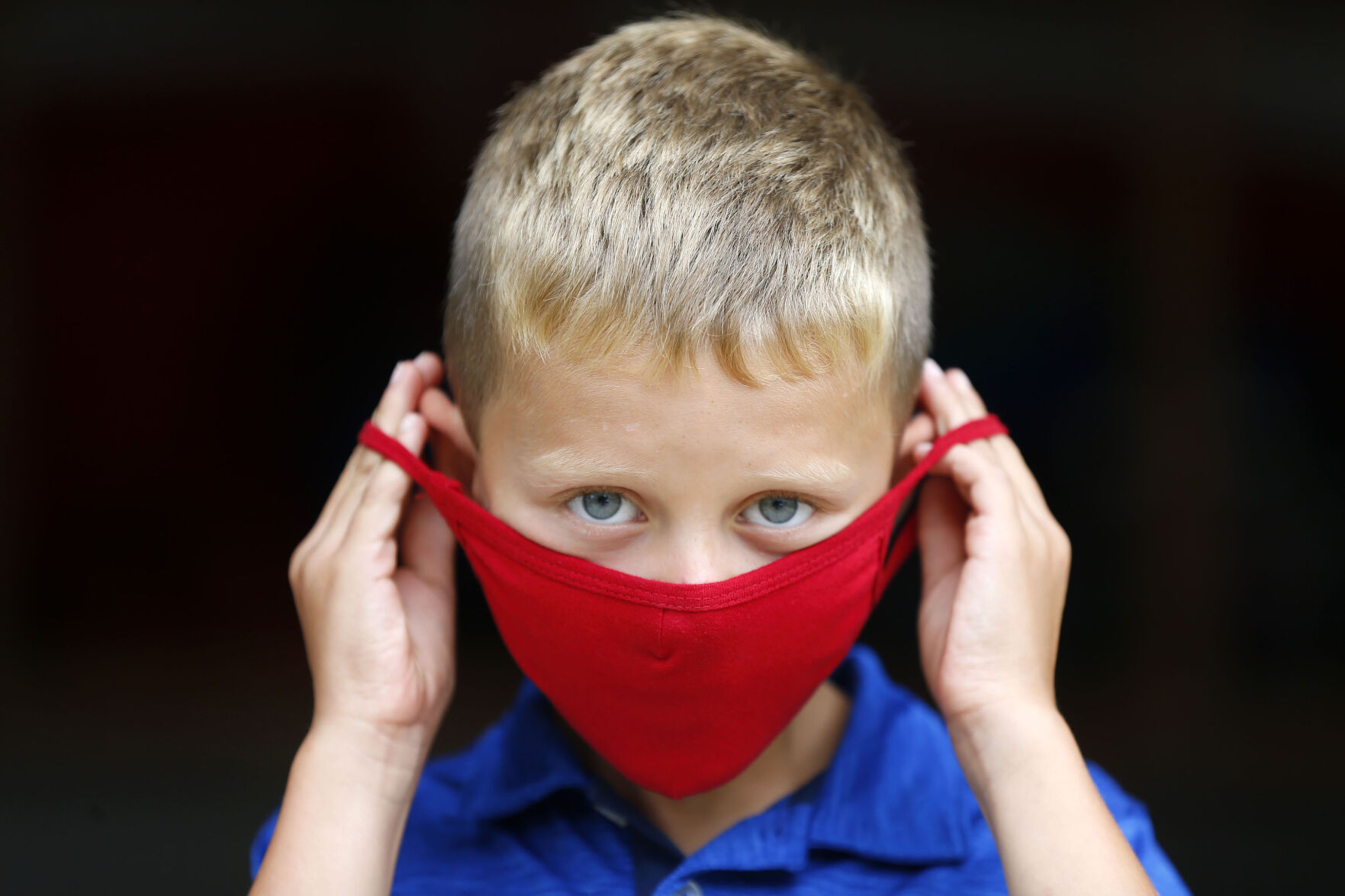 Children show off their face masks